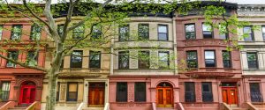 Row of cute brownstone houses property management in new york